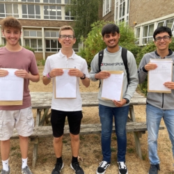 Happy students from Stratton Upper School holding their exam certificates