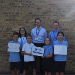 A pictures of four pupils and three adults